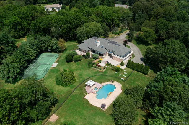 an aerial view of residential house with outdoor space and street view