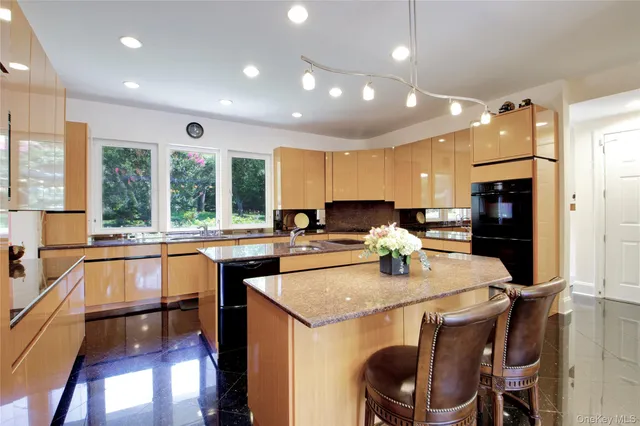 a kitchen with a stove a sink and a refrigerator