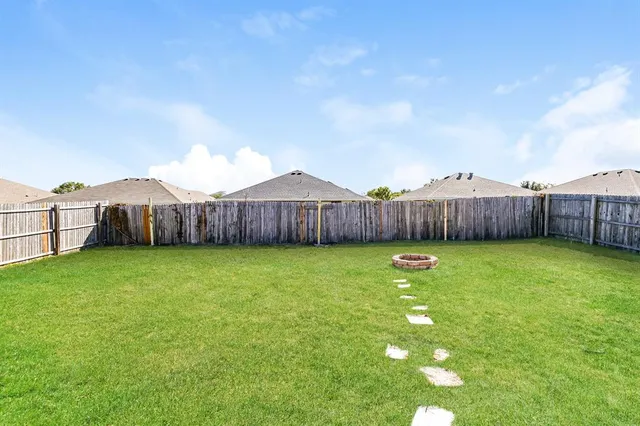 a view of a house with a back yard