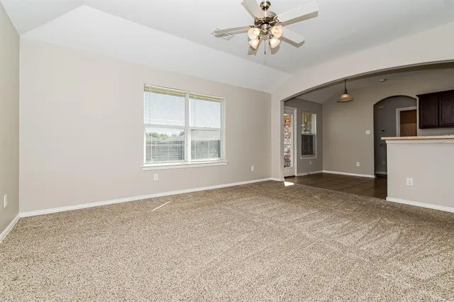 a view of an empty room with a window