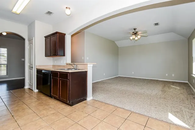 a kitchen with a sink and cabinets