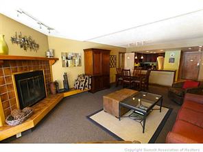 800 Copper Road, Unit 173 Copper Mountain, CO 80443 - Photo 3 of 17 a living room with furniture and a fireplace