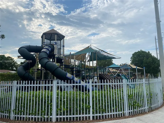 a view of a wrought iron fences in front of house