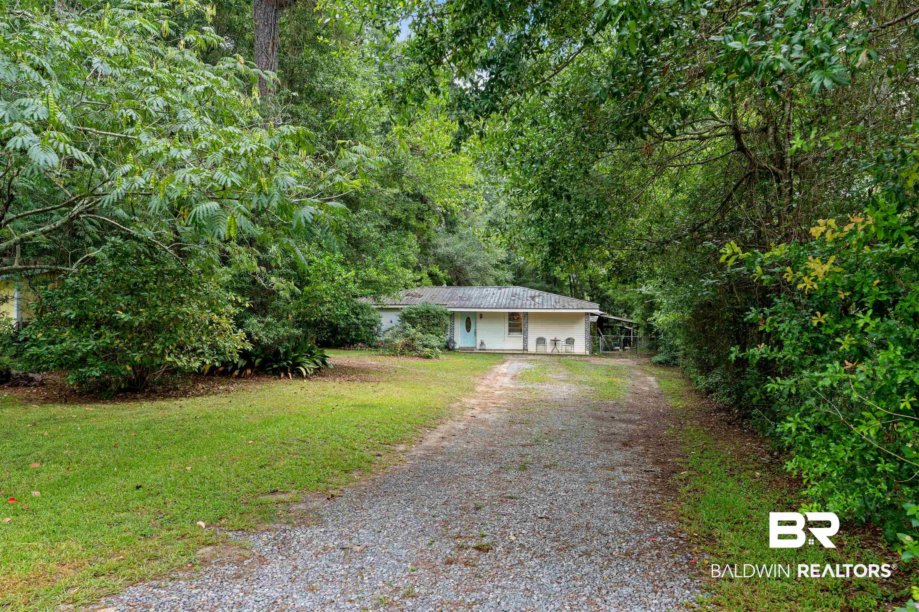 922 Dauphine Circle Daphne, AL 36526 - Photo 29 of 29 Ranch-style home featuring driveway, a front yard, and a forest view
