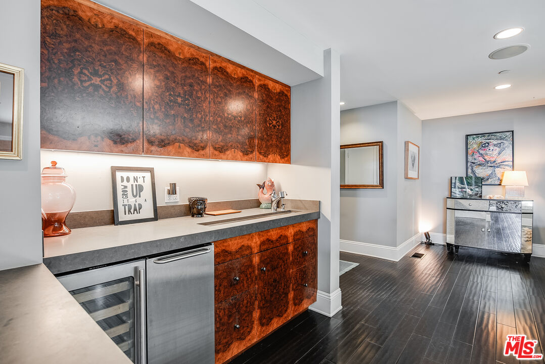 2962 Valmere Drive Malibu, CA 90265 - Photo 11 of 42 a kitchen with stainless steel appliances a stove and wooden floor