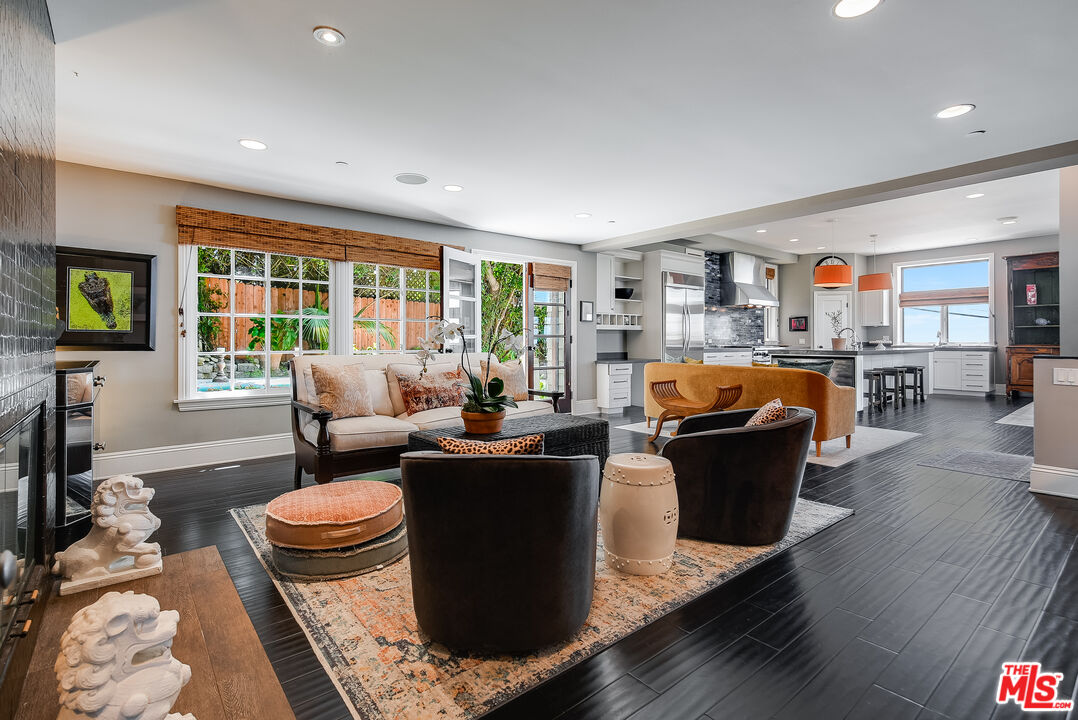 2962 Valmere Drive Malibu, CA 90265 - Photo 12 of 42 a living room with furniture a rug and a large window