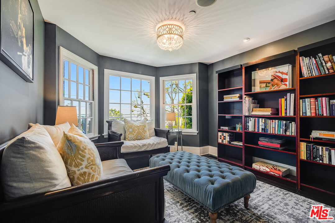 2962 Valmere Drive Malibu, CA 90265 - Photo 14 of 42 a living room with furniture and a book shelf