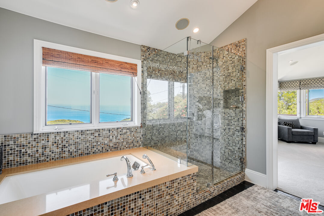 2962 Valmere Drive Malibu, CA 90265 - Photo 27 of 42 a bathroom with a bathtub and a shower