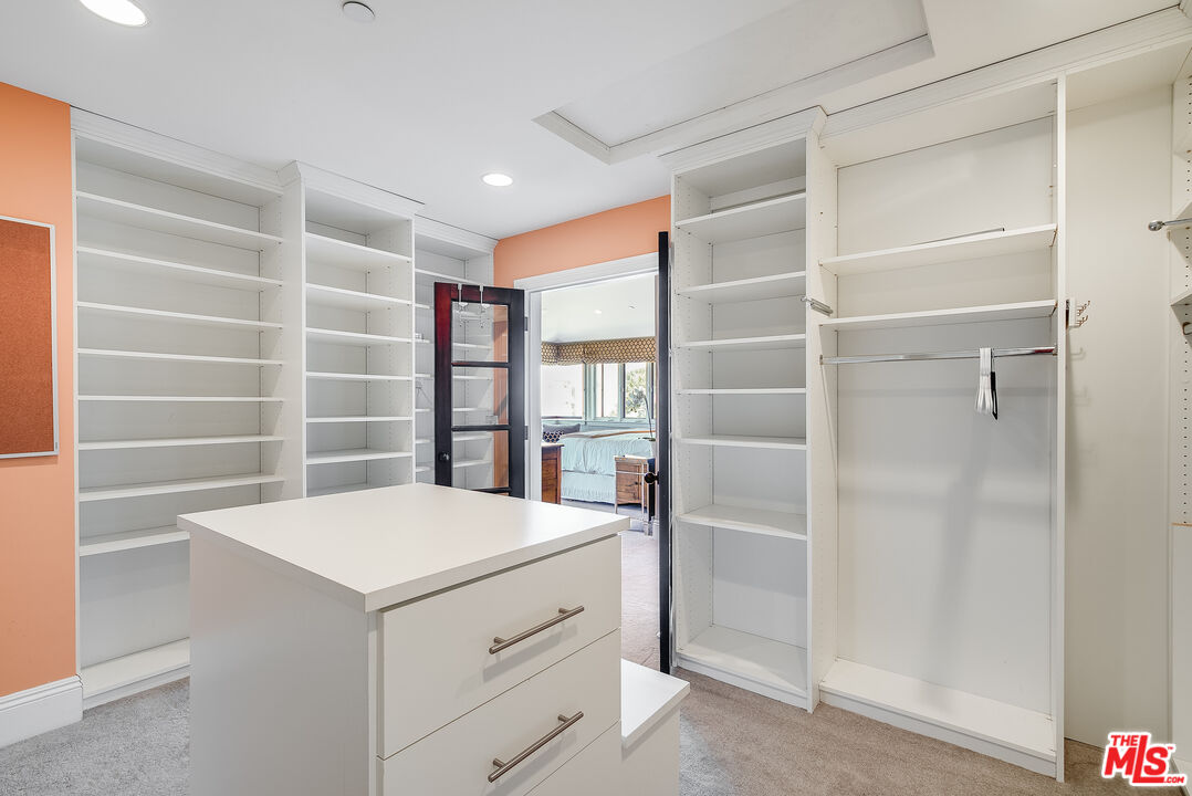 2962 Valmere Drive Malibu, CA 90265 - Photo 29 of 42 a room with a cabinets and a wooden floors