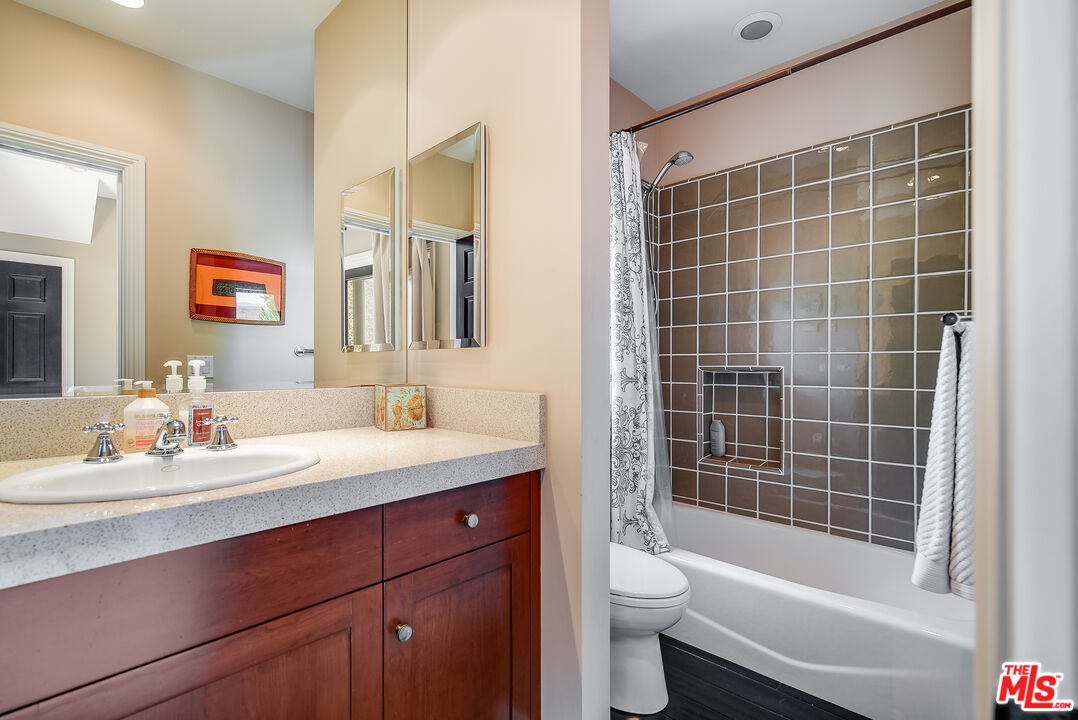 2962 Valmere Drive Malibu, CA 90265 - Photo 36 of 42 a bathroom with a sink a toilet and shower