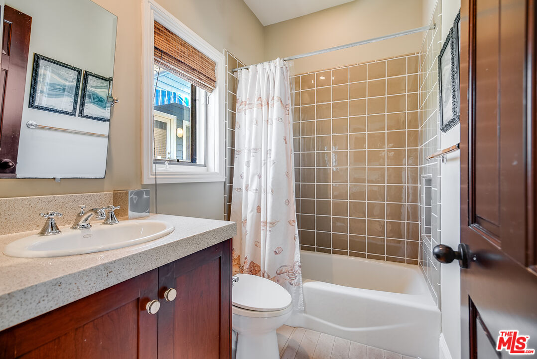 2962 Valmere Drive Malibu, CA 90265 - Photo 39 of 42 a bathroom with a sink toilet and shower