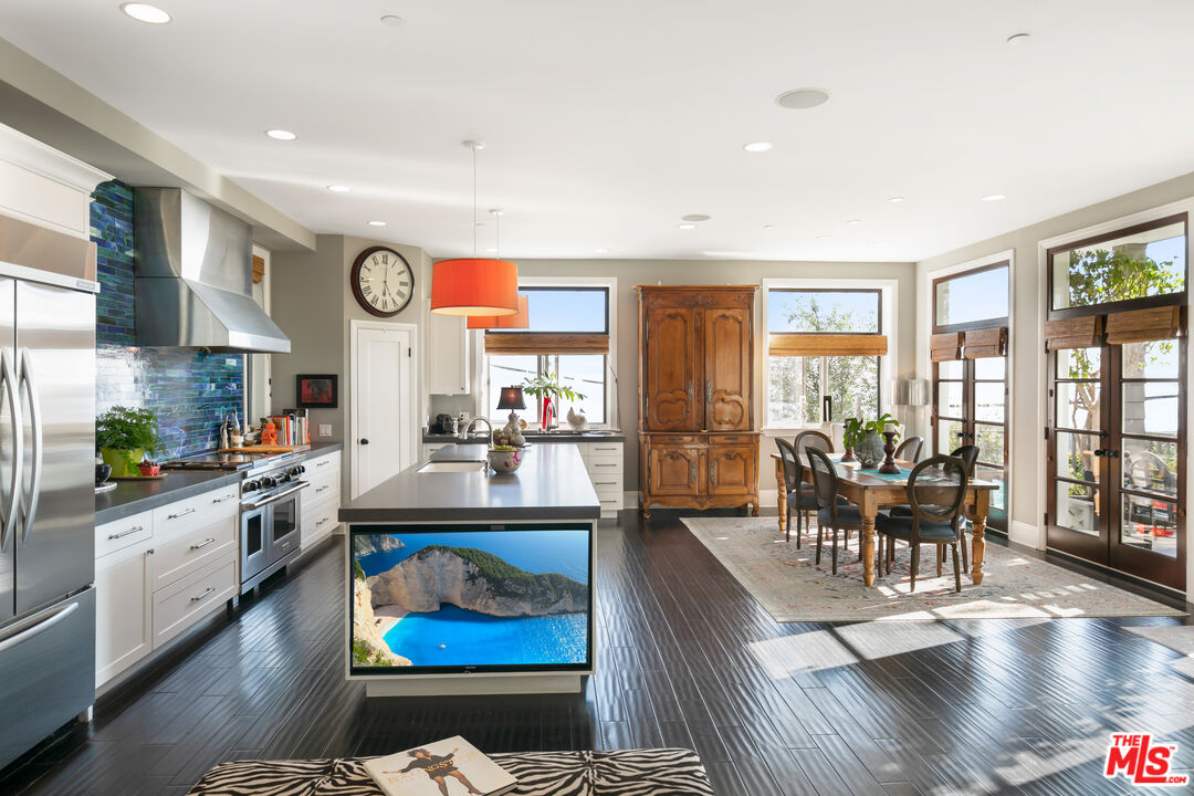 2962 Valmere Drive Malibu, CA 90265 - Photo 9 of 42 a large living room with stainless steel appliances granite countertop lots of furniture and a large window