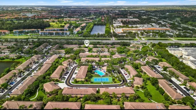 an aerial view of residential houses with outdoor space and river