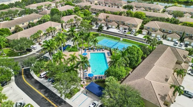 an aerial view of residential houses with outdoor space