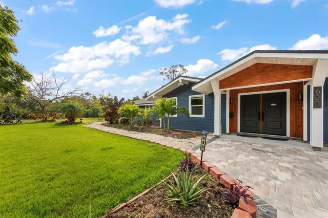 a front view of a house with garden