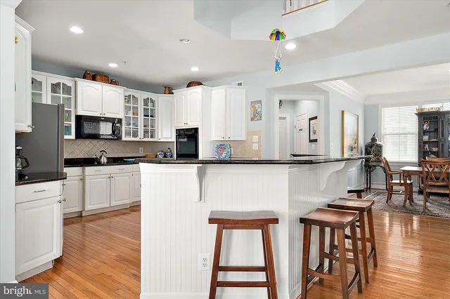 a view of entryway with stairs and wooden floor