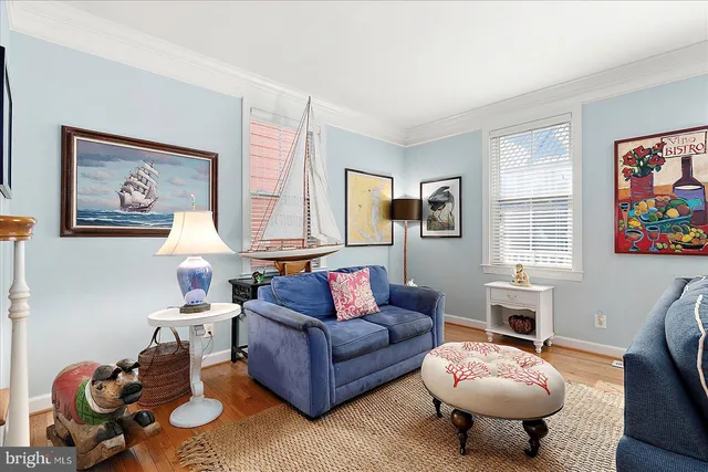 a bedroom with a bed and a lamp on dresser