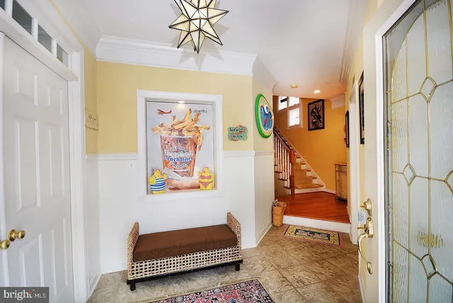 a view of a bedroom with furniture and window