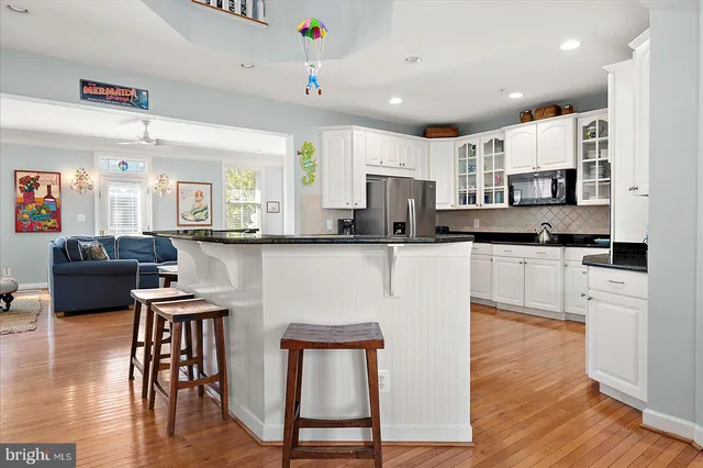 a view of a balcony with wooden floor