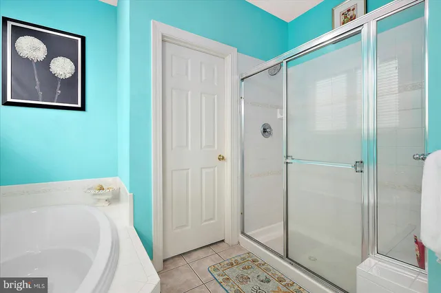 a front view of a residential apartment building with a yard