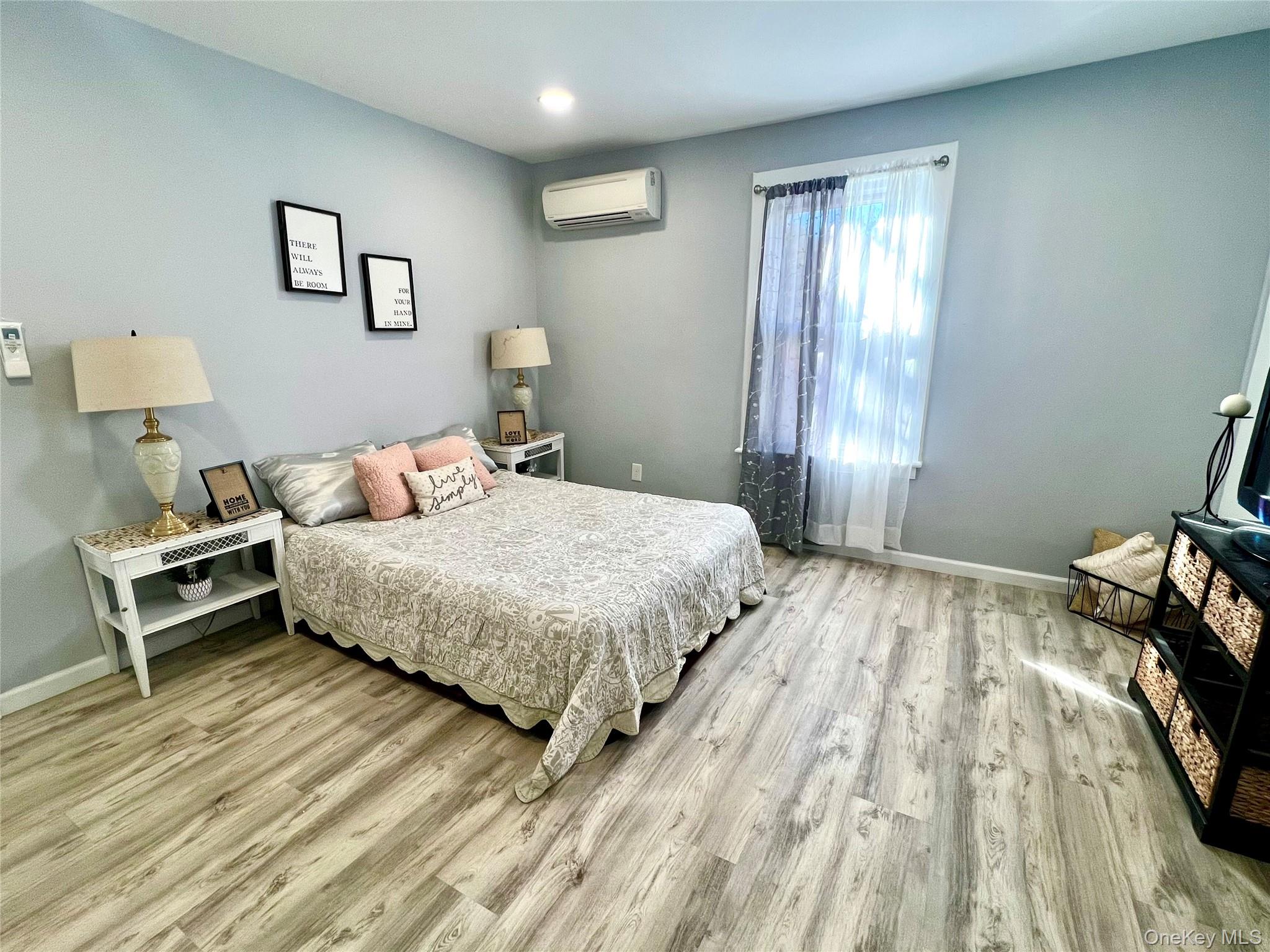 126 West Main Street, Unit 1 Middletown, NY 10940 - Photo 20 of 29 a bedroom with a bed and a window