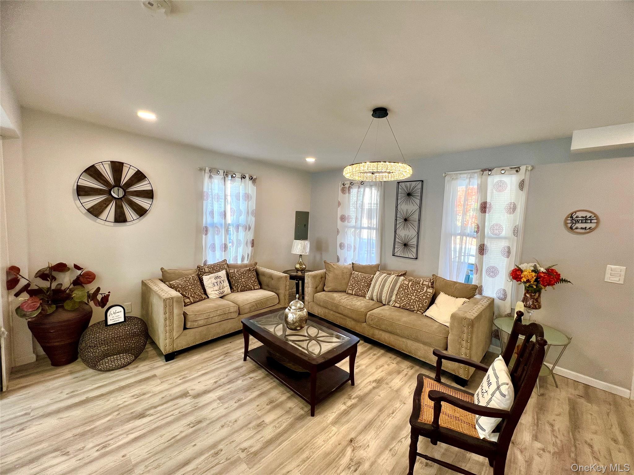126 West Main Street, Unit 1 Middletown, NY 10940 - Photo 2 of 29 a living room with furniture and wooden floor