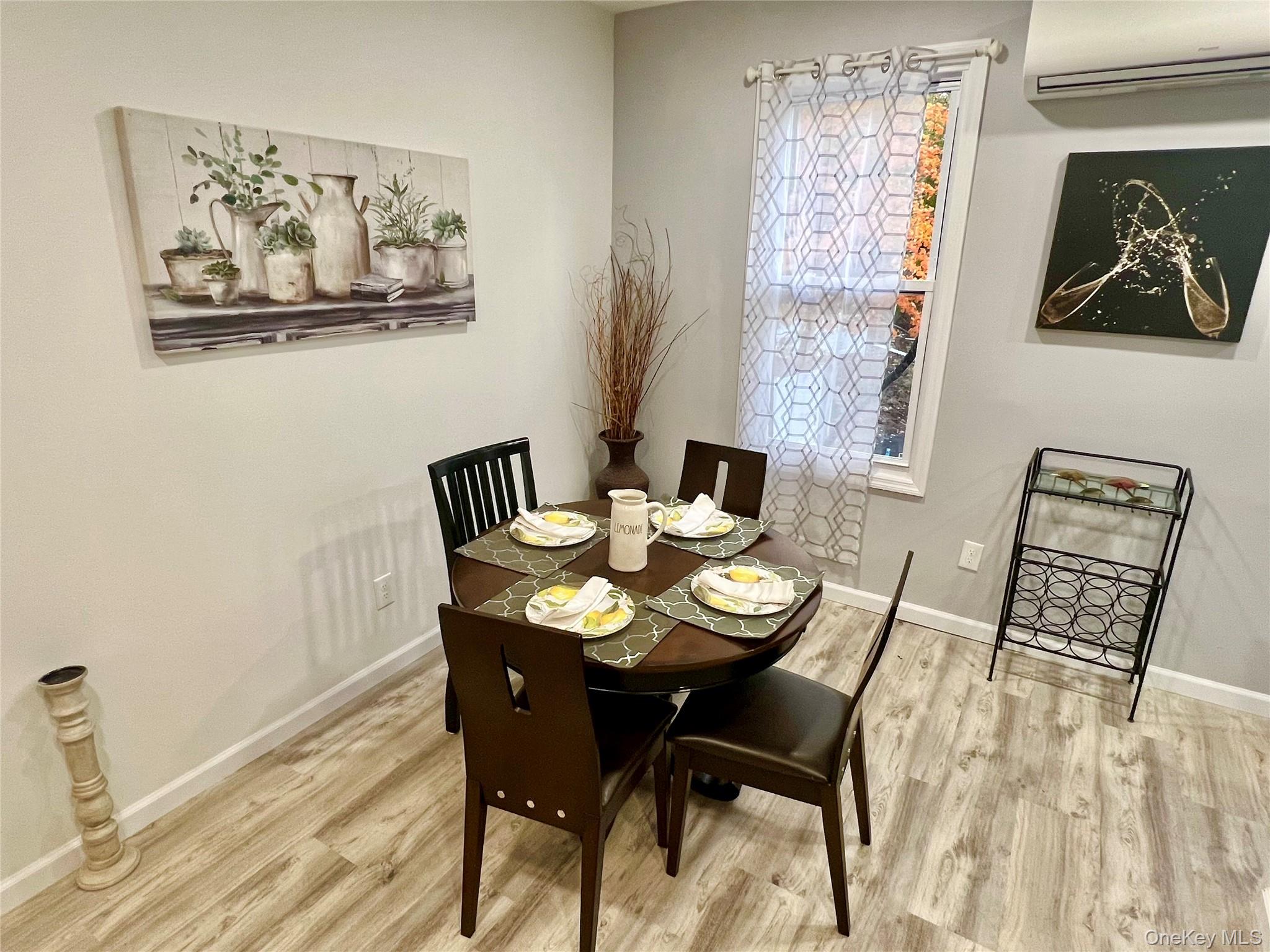 126 West Main Street, Unit 1 Middletown, NY 10940 - Photo 7 of 29 a view of a dining room with furniture and wooden floor