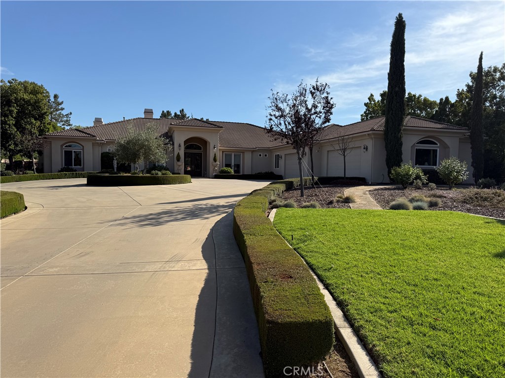 1662 Cherokee Road Corona, CA 92881 - Photo 1 of 60 a front view of a house with garden