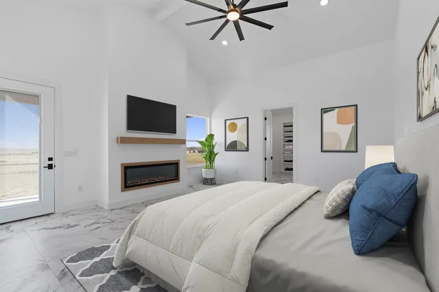 a bedroom with a bed and a fireplace