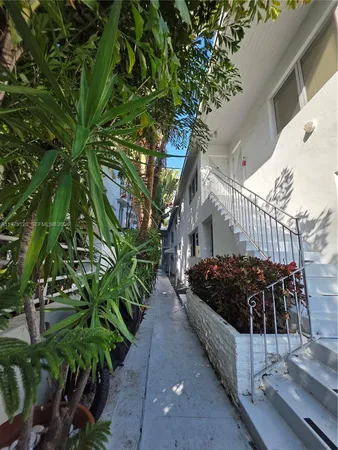a view of a house with a flower garden