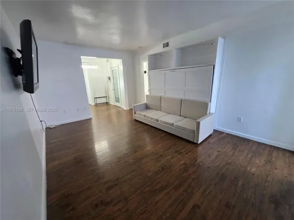 a view of livingroom with furniture and wooden floor