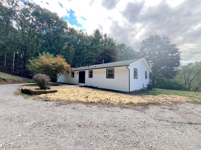 6285 Adams Road Northeast New Philadelphia, OH 44663 - Photo 25 of 32 Ranch-style house with a patio area