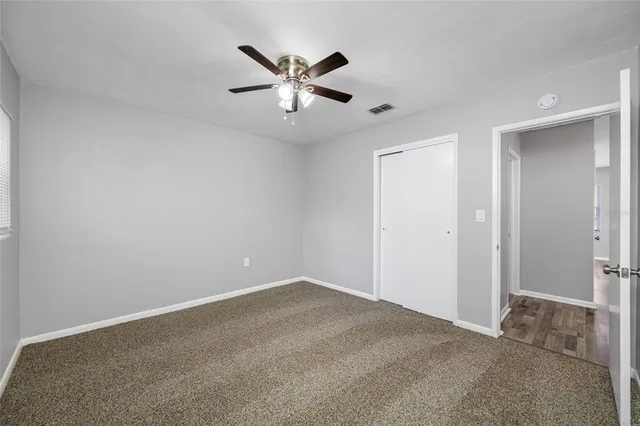 a view of a big room with carpet
