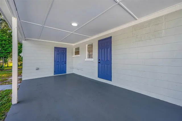 a view of an empty room with windows