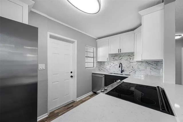 a kitchen with a sink and cabinets