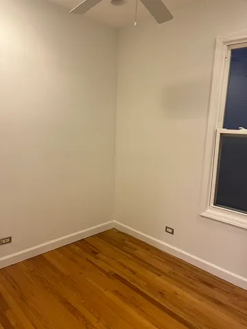 a view of a room with wooden floor and small space