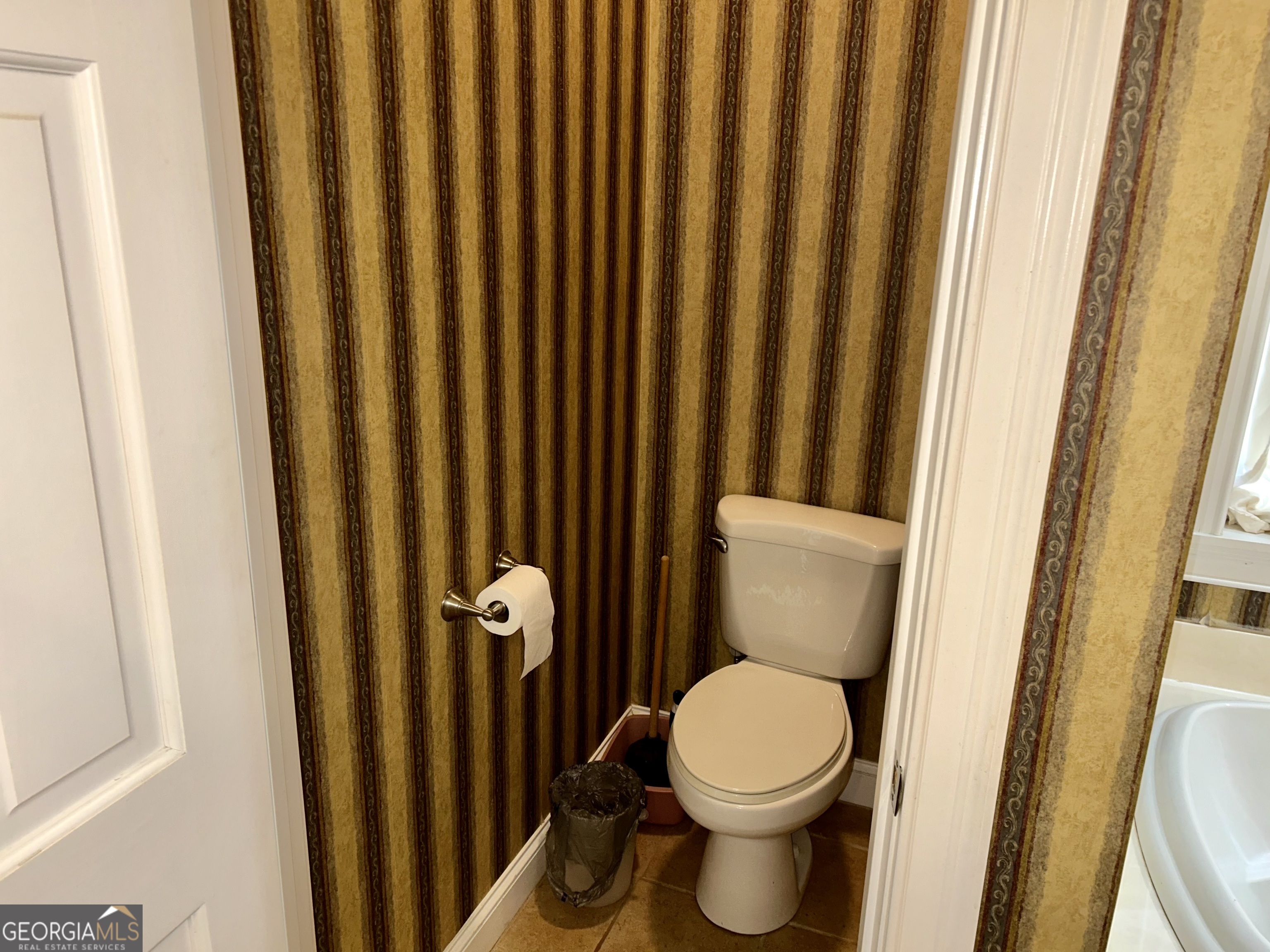 518 Fambrough Drive Elberton, GA 30635 - Photo 37 of 74 a bathroom with a toilet and a shower curtain