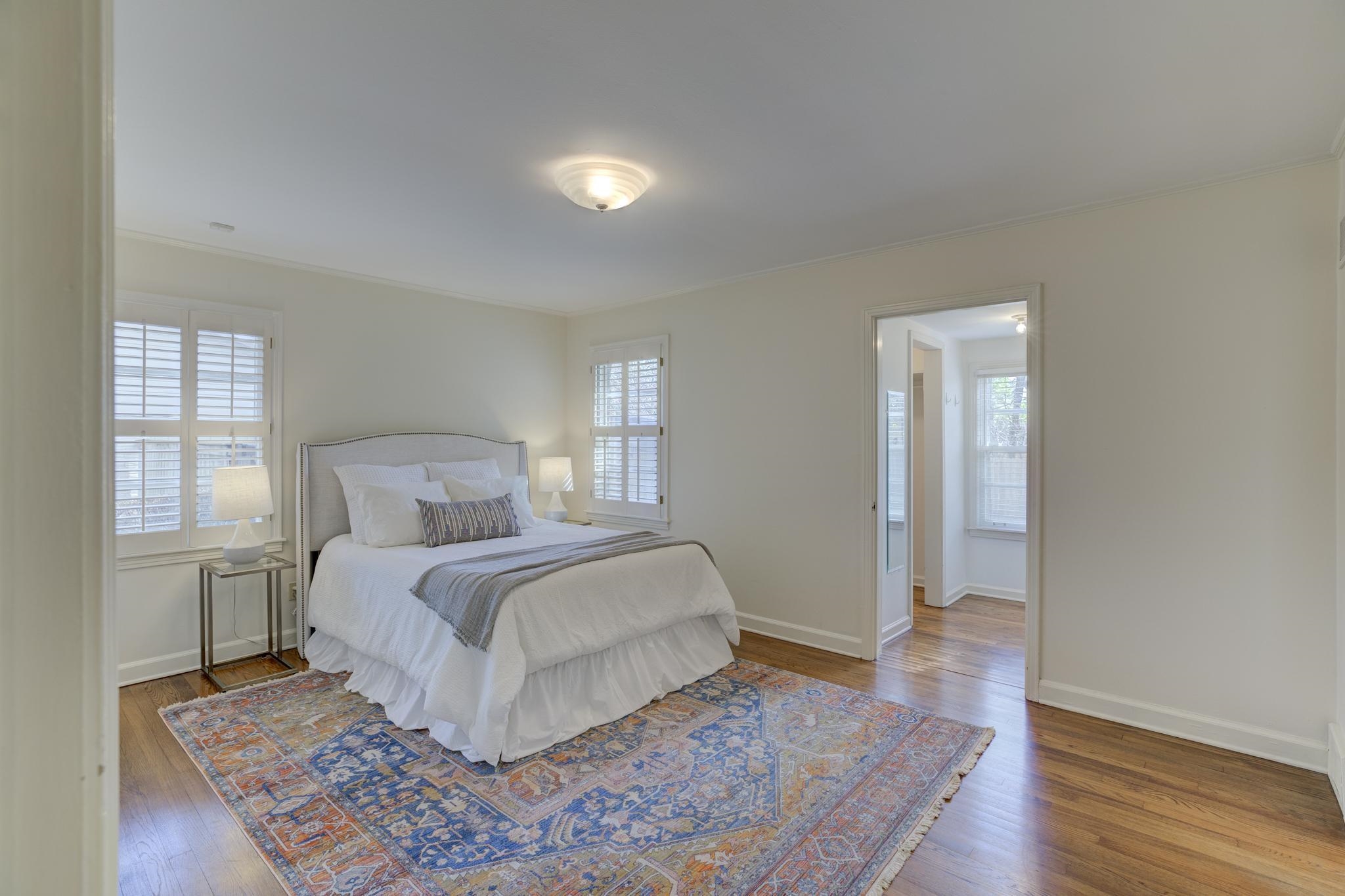 4945 Cole Road Memphis, TN 38117 - Photo 16 of 25 a bedroom with a bed and wooden floor