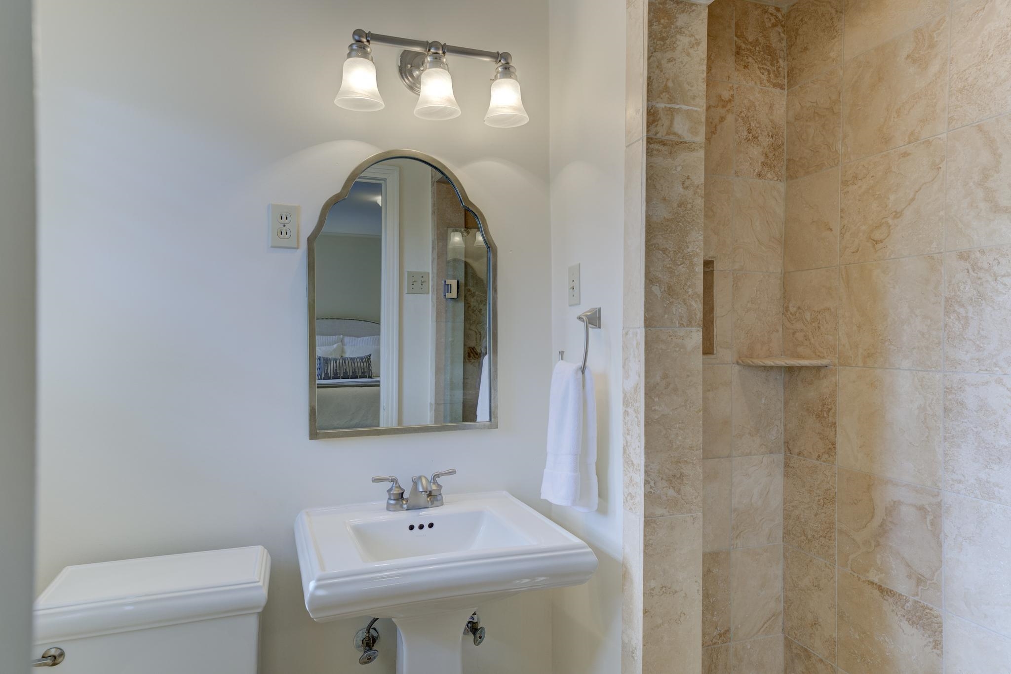 4945 Cole Road Memphis, TN 38117 - Photo 17 of 25 a bathroom with a sink and a mirror