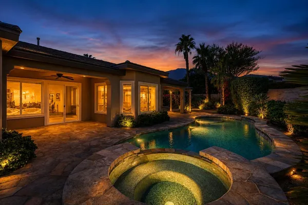 a view of swimming pool with outdoor seating