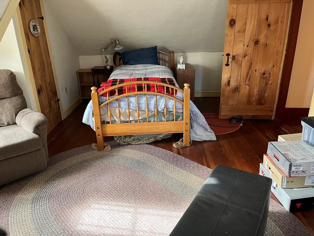 258 Chestnut Street Rehoboth, MA 02769 - Photo 16 of 34 a view of an bedroom with furniture and a fireplace