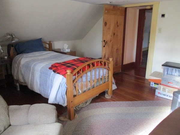 258 Chestnut Street Rehoboth, MA 02769 - Photo 17 of 34 a bedroom with a bed and wooden floor
