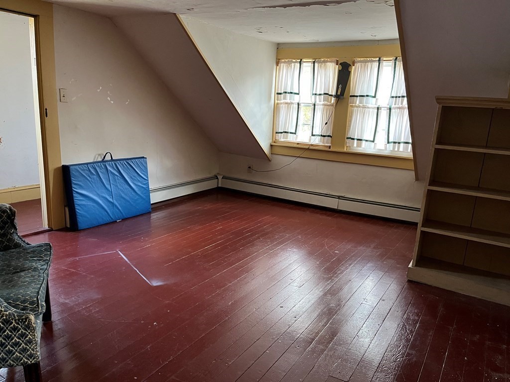 258 Chestnut Street Rehoboth, MA 02769 - Photo 18 of 34 an empty room with wooden floor and windows