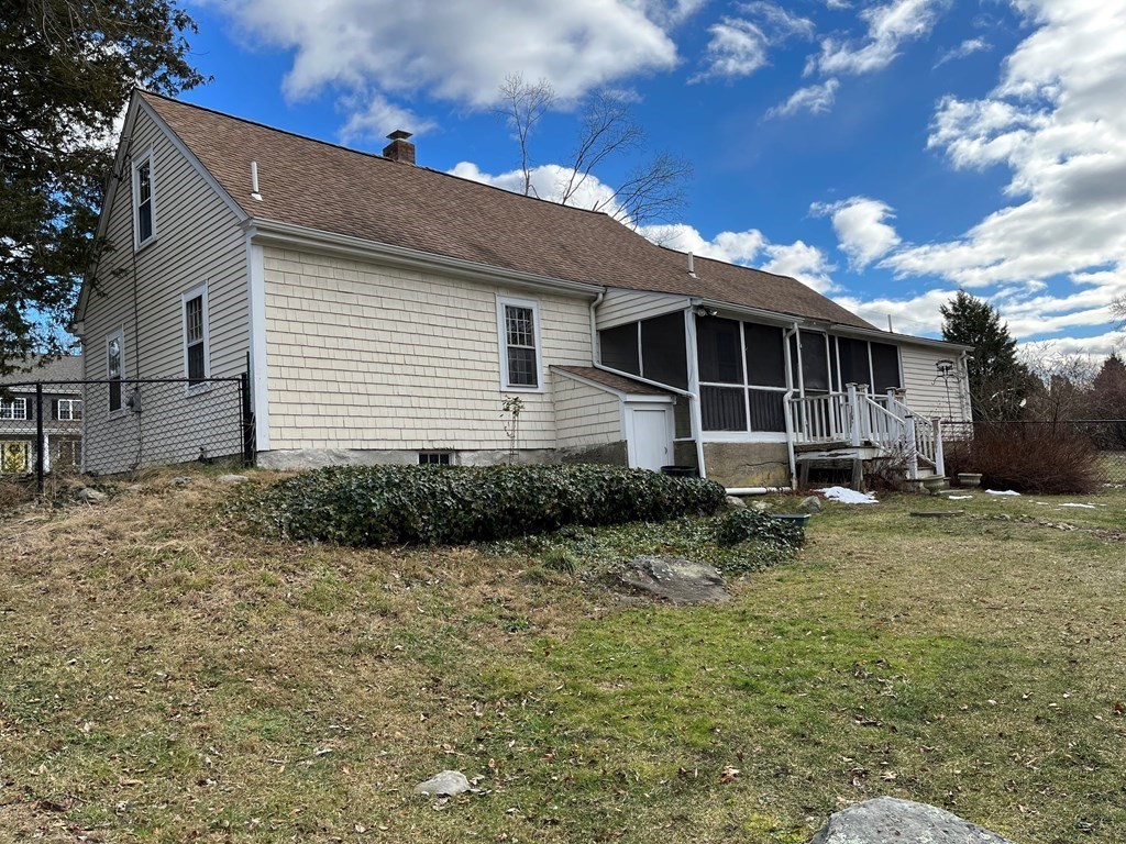 258 Chestnut Street Rehoboth, MA 02769 - Photo 27 of 34 a backyard of a house with plants and tree