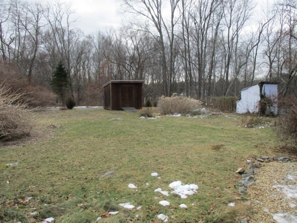 258 Chestnut Street Rehoboth, MA 02769 - Photo 34 of 34 a backyard of a house with table and chairs