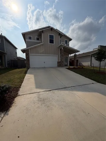 a front view of a house with yard