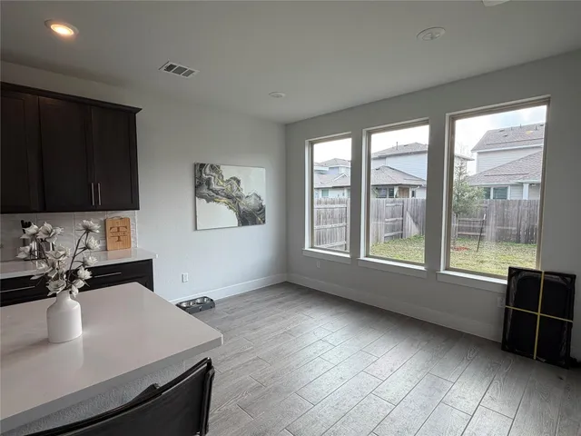 a kitchen with a sink a stove and a refrigerator