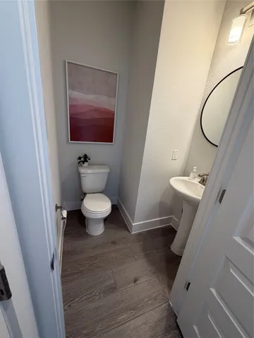 a bathroom with a toilet and a sink