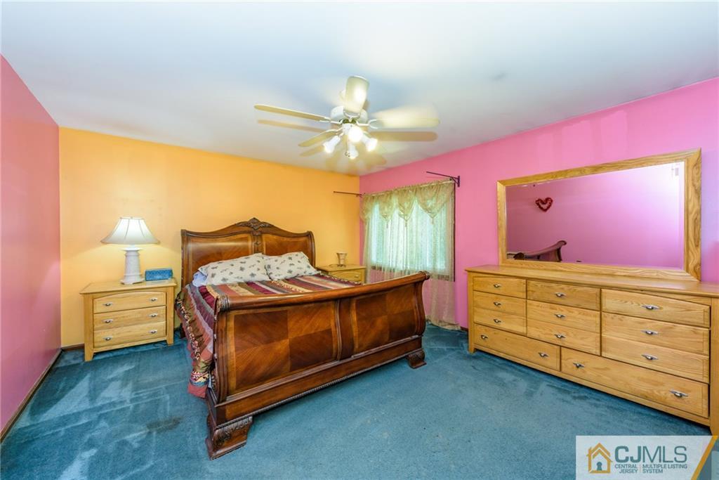104 North Hope Chapel Road Jackson, NJ 08527 - Photo 22 of 40 a bedroom with a bed and a dresser