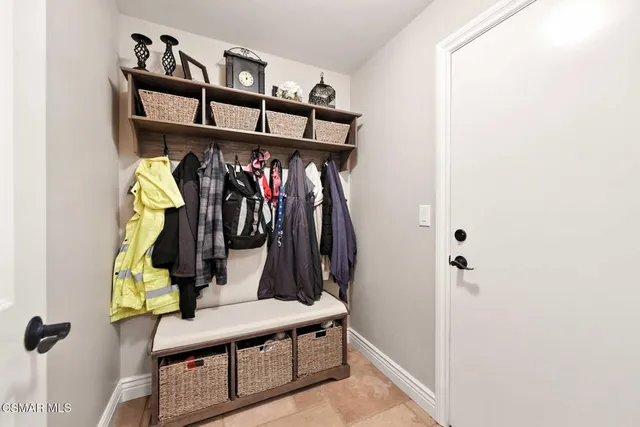 a kitchen with stainless steel appliances kitchen island granite countertop a sink a counter top space and cabinets